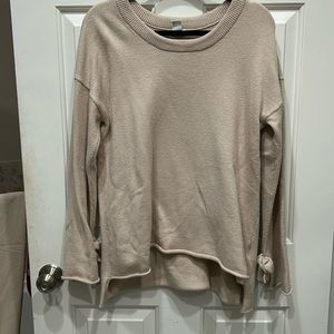 Oversized sweater with bow tie on arms